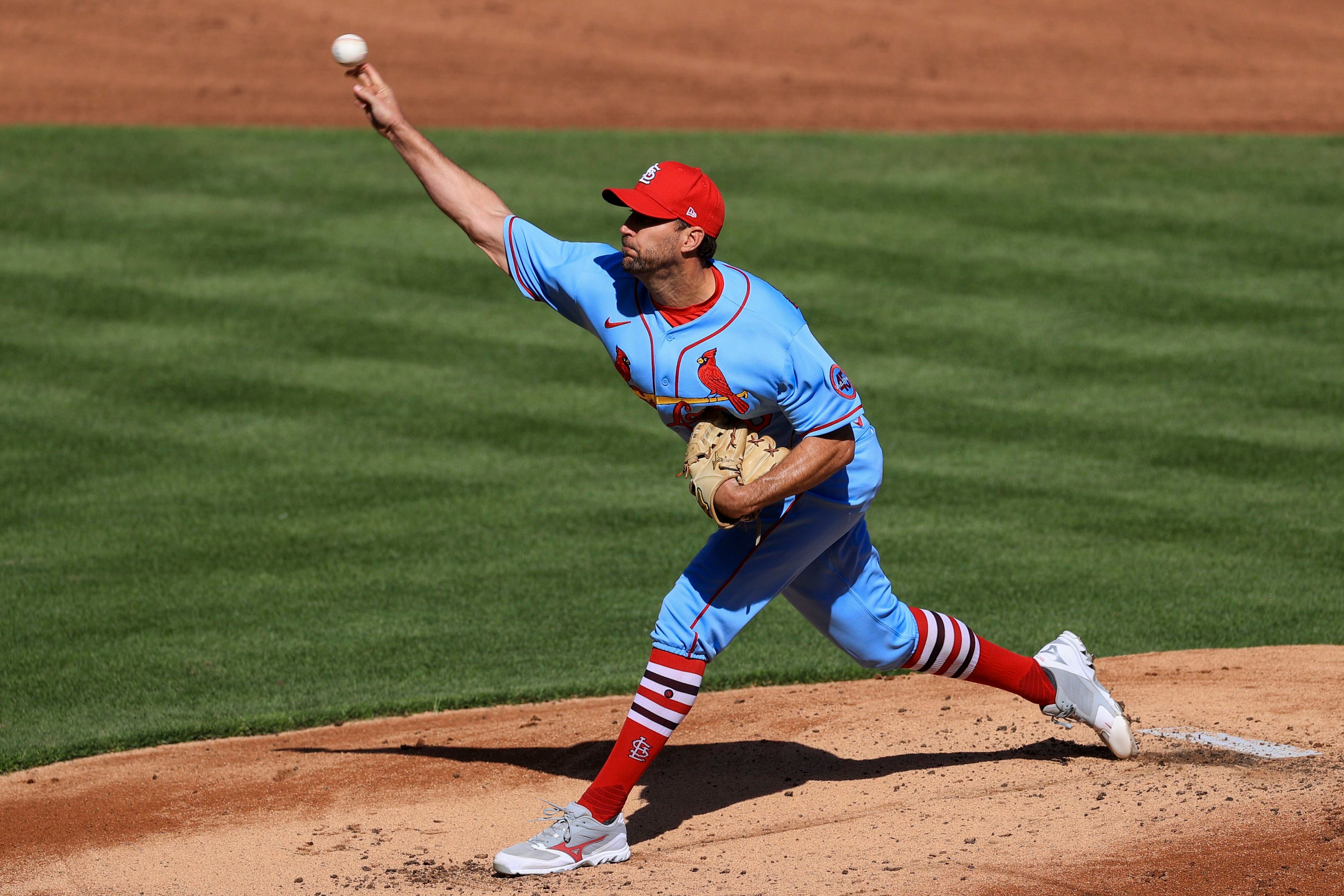 Reds scrap with Cards at plate, tangle in outfield, win 9-6