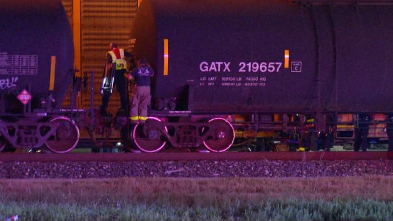 Man caught in freight train door travels 15 miles, dangling by his foot