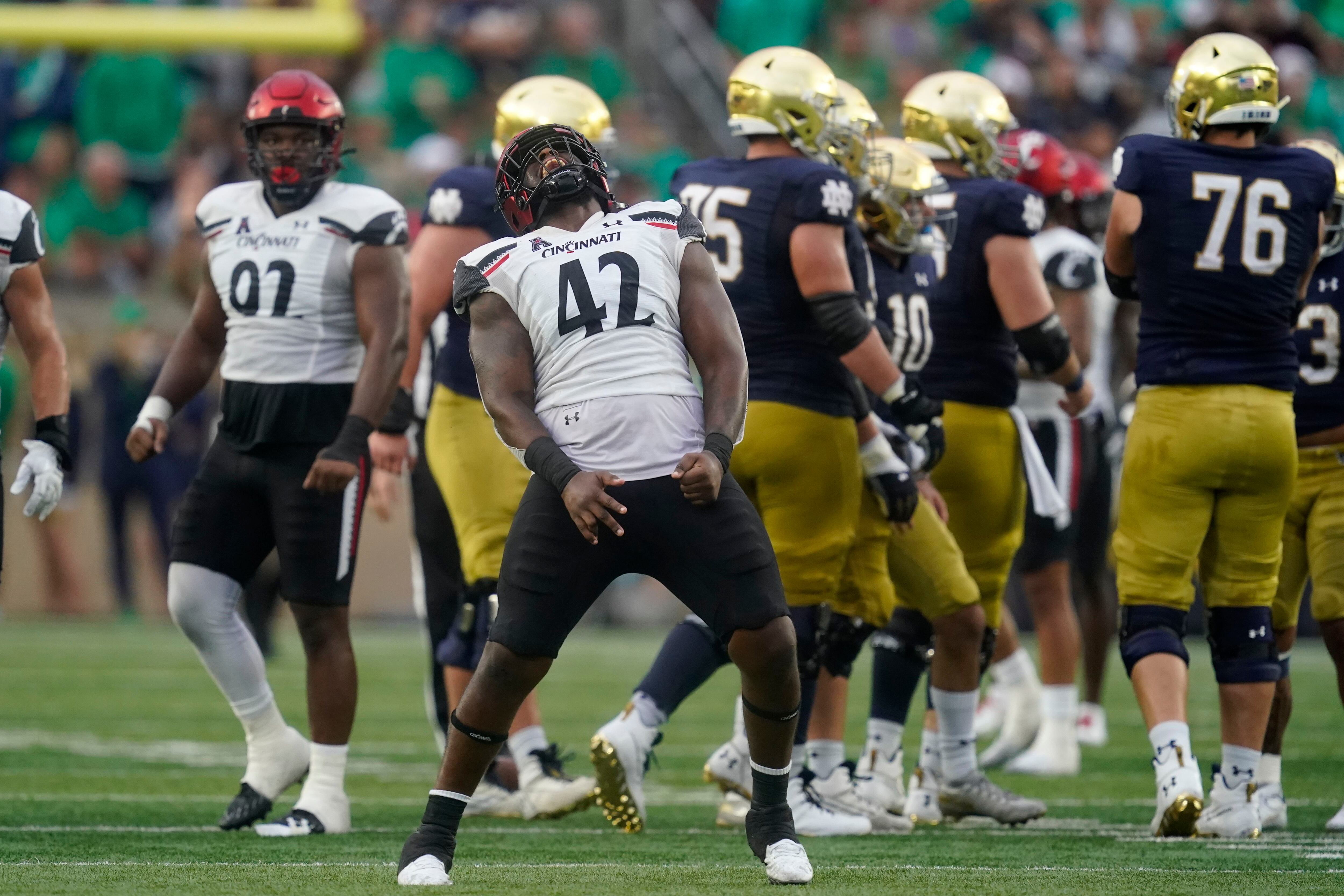 Desmond Ridder shines as No. 7/8 Cincinnati defeats No. 9/7 Notre Dame  24-13 in South Bend