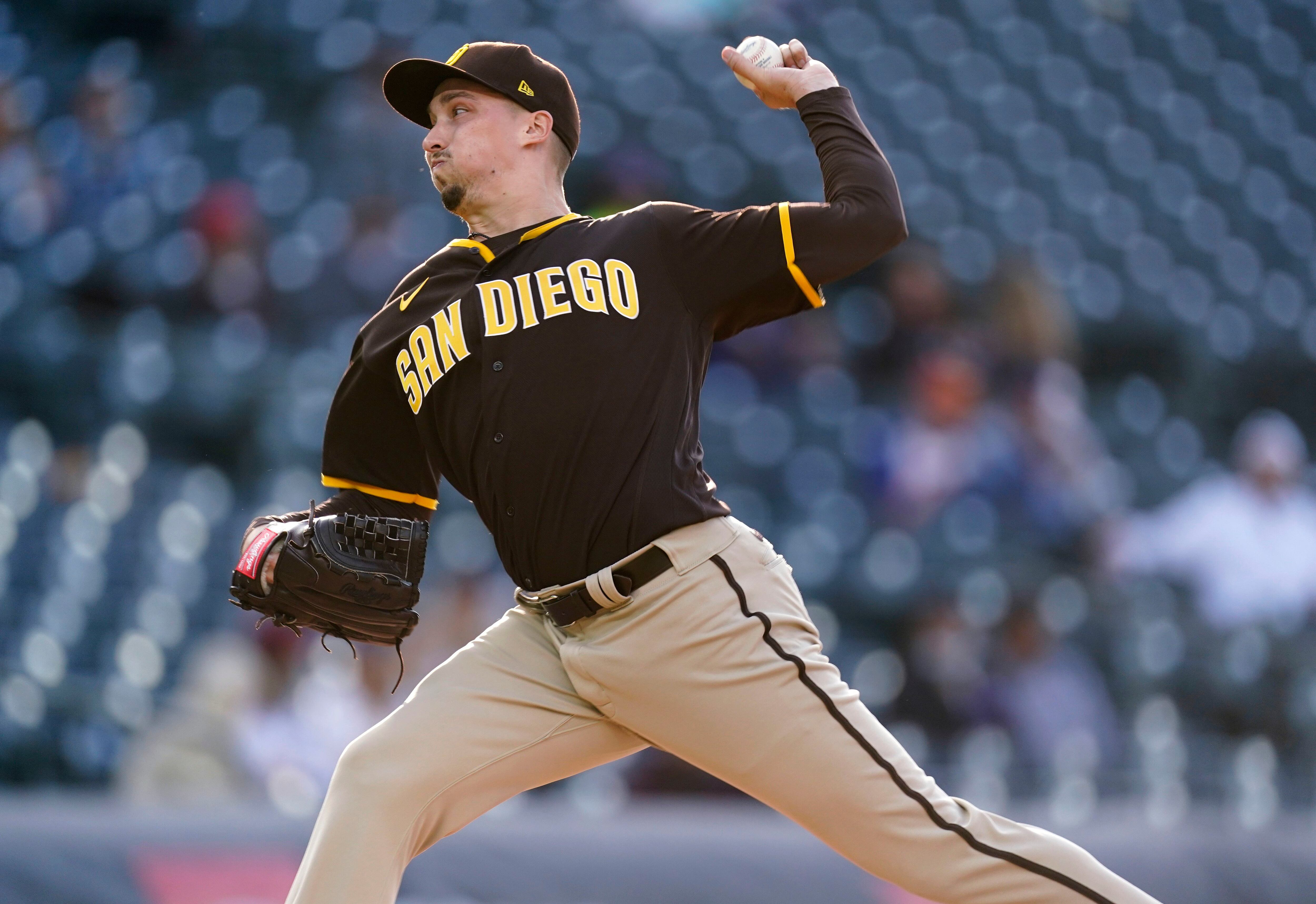 San Diego Padres' Victor Caratini heads up the first-base line after  connecting for a grand slam off Colorado Rockies relief pitcher Robert  Stephenson in the sixth inning of game one of a