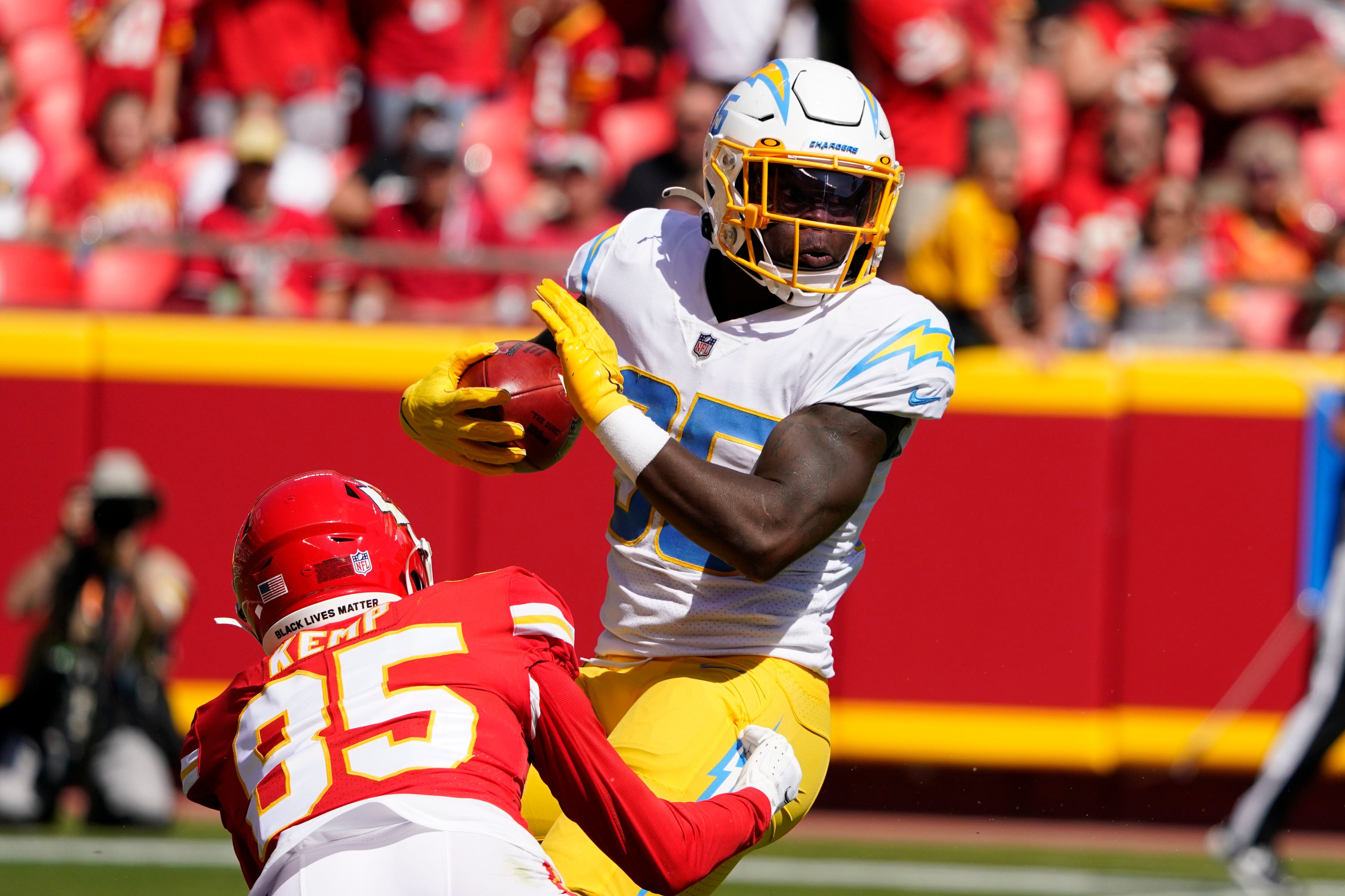 Kansas City Chiefs quarterback Patrick Mahomes runs the ball during the  second half of an NFL football game against the Los Angeles Chargers  Sunday, Sept. 26, 2021, in Kansas City, Mo. (AP