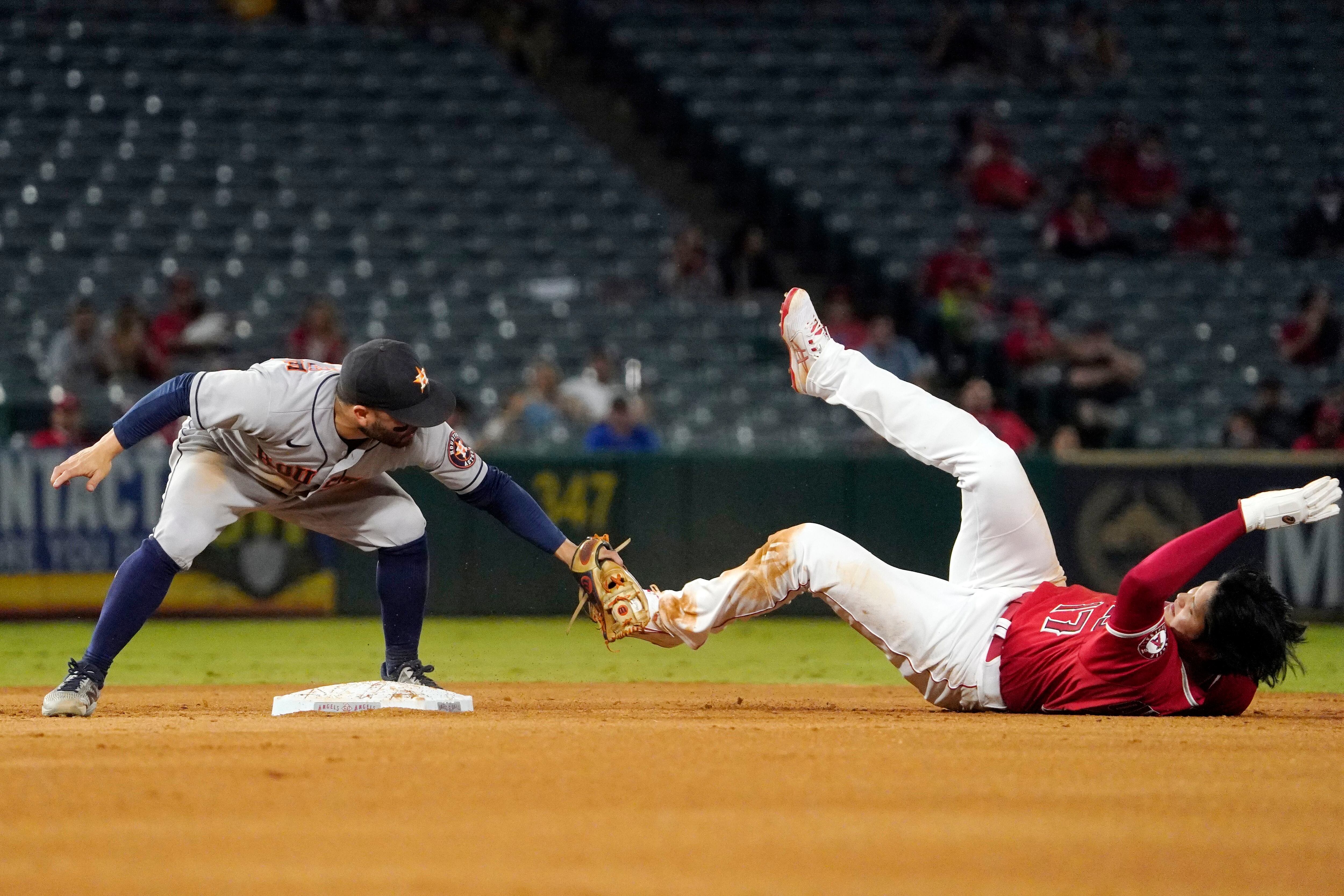 Astros move closer, beat Angels in 12; Ohtani out at plate