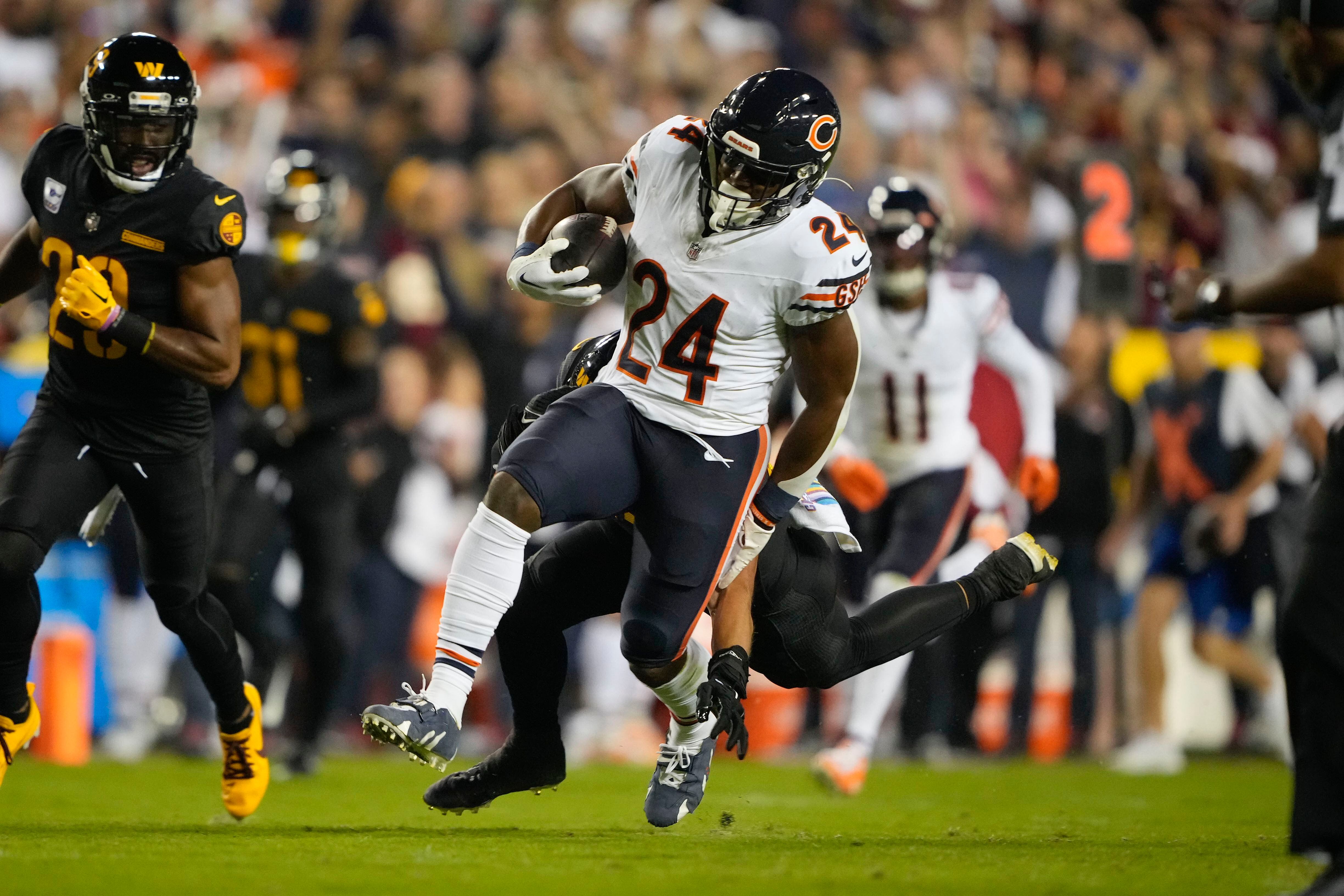 running back Khalil Herbert of the Chicago Bears and quarterback