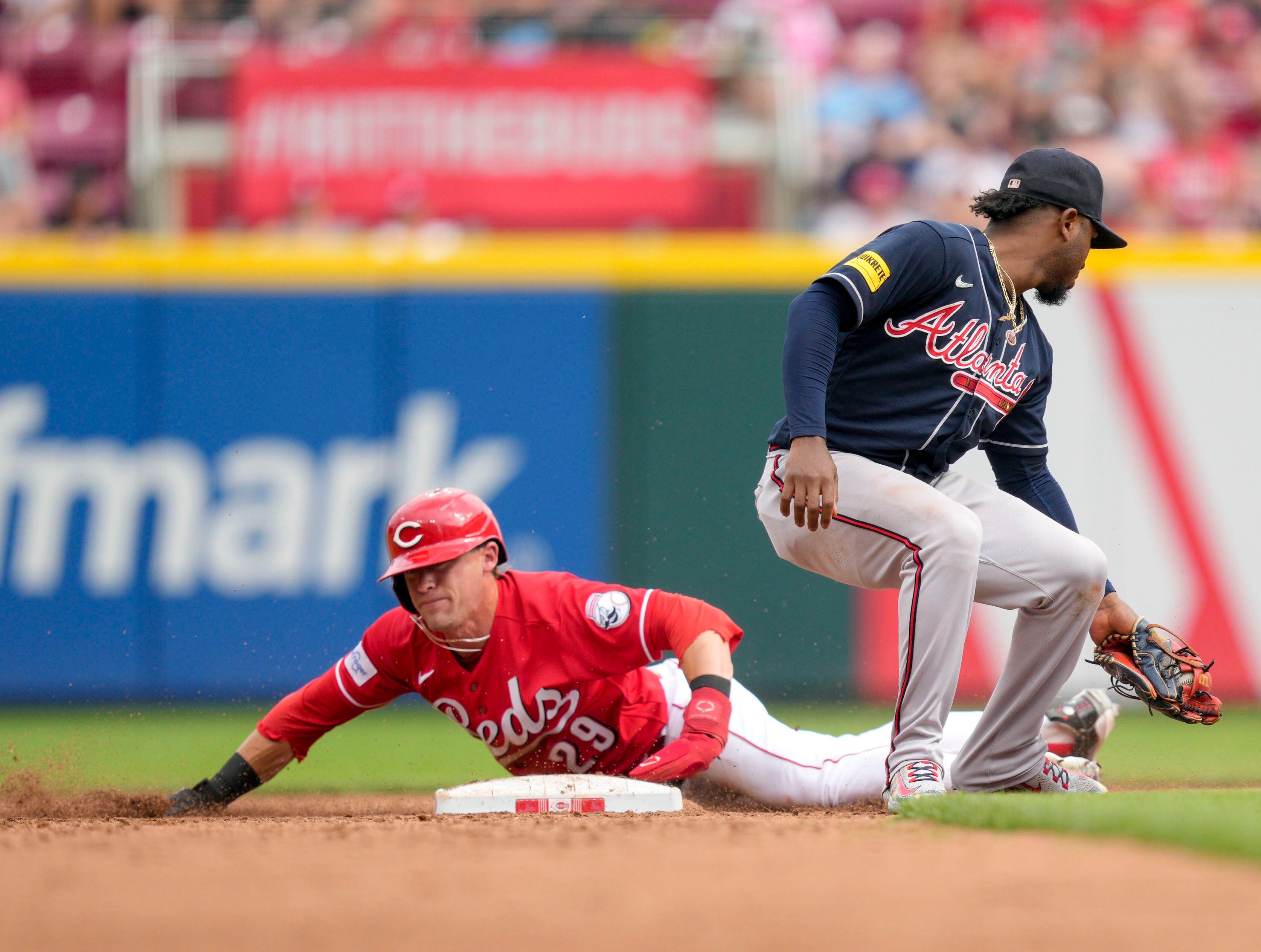 Braves end Reds' 12-game streak in thrilling slugfest