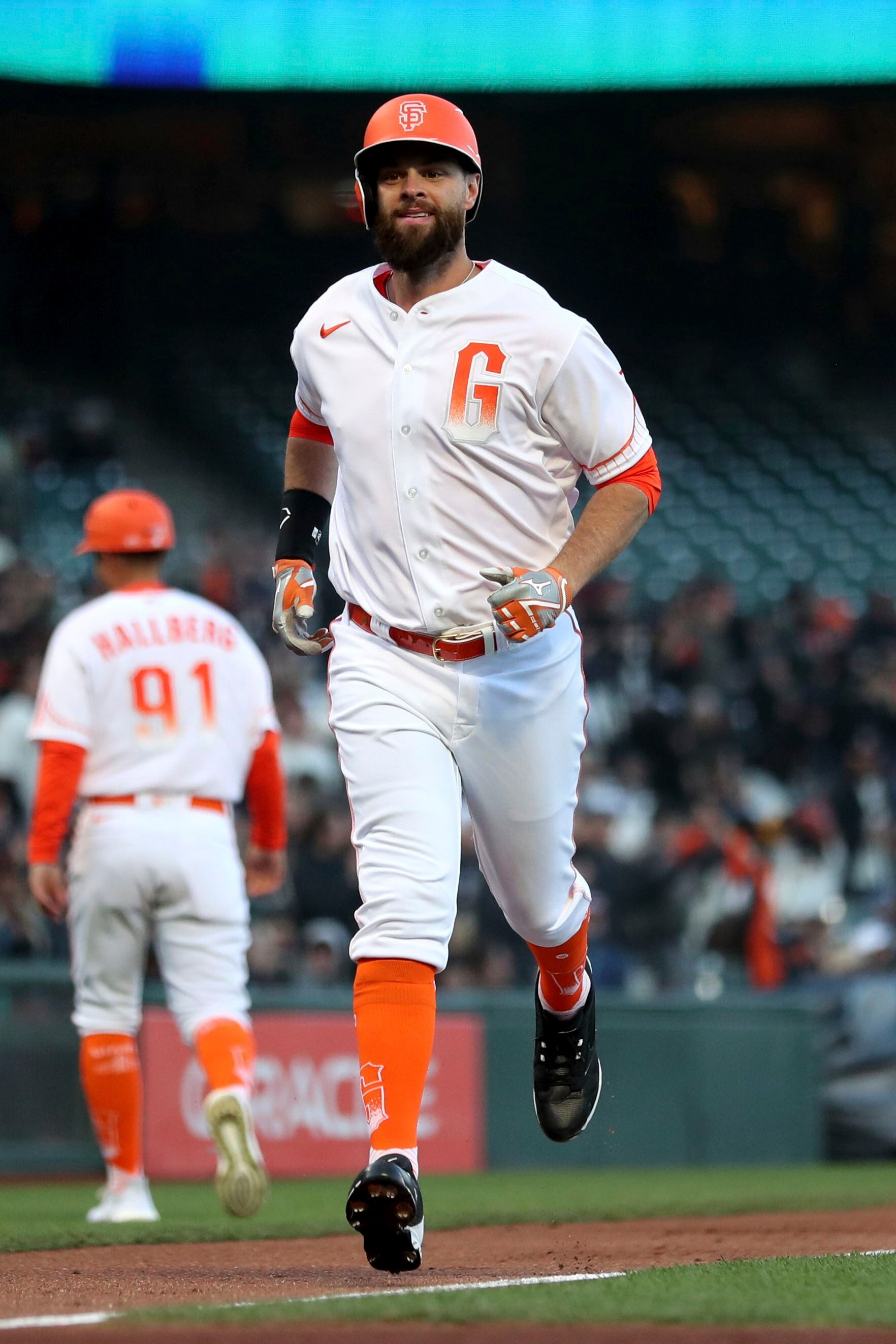 San Francisco Giants' Logan Webb wears a hat and shirt for first baseman  Brandon Belt before a baseball game between the Giants and the Arizona  Diamondbacks in San Francisco, Wednesday, Sept. 29