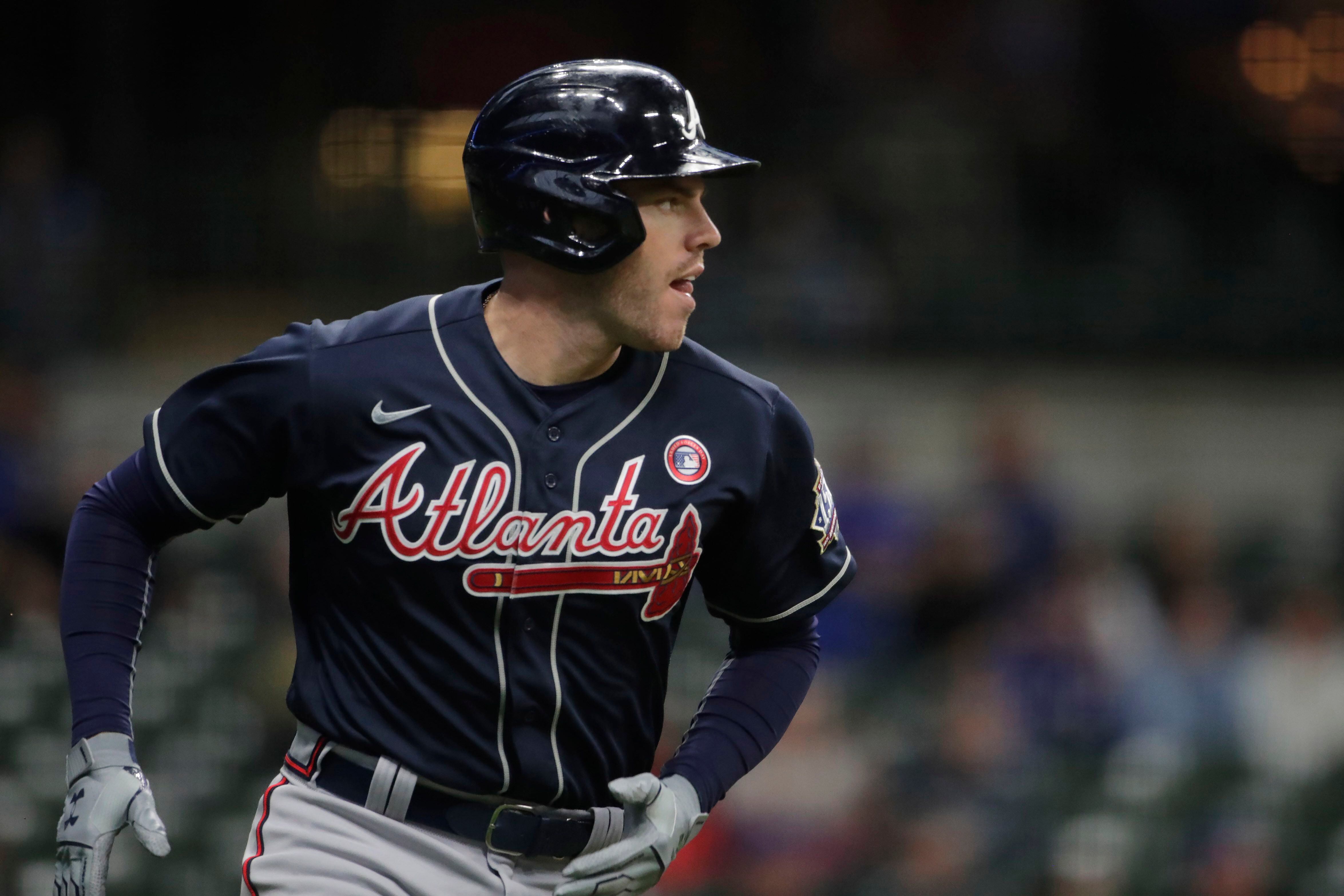 Huascar Ynoa and Tyler Flowers of the Atlanta Braves walk toward