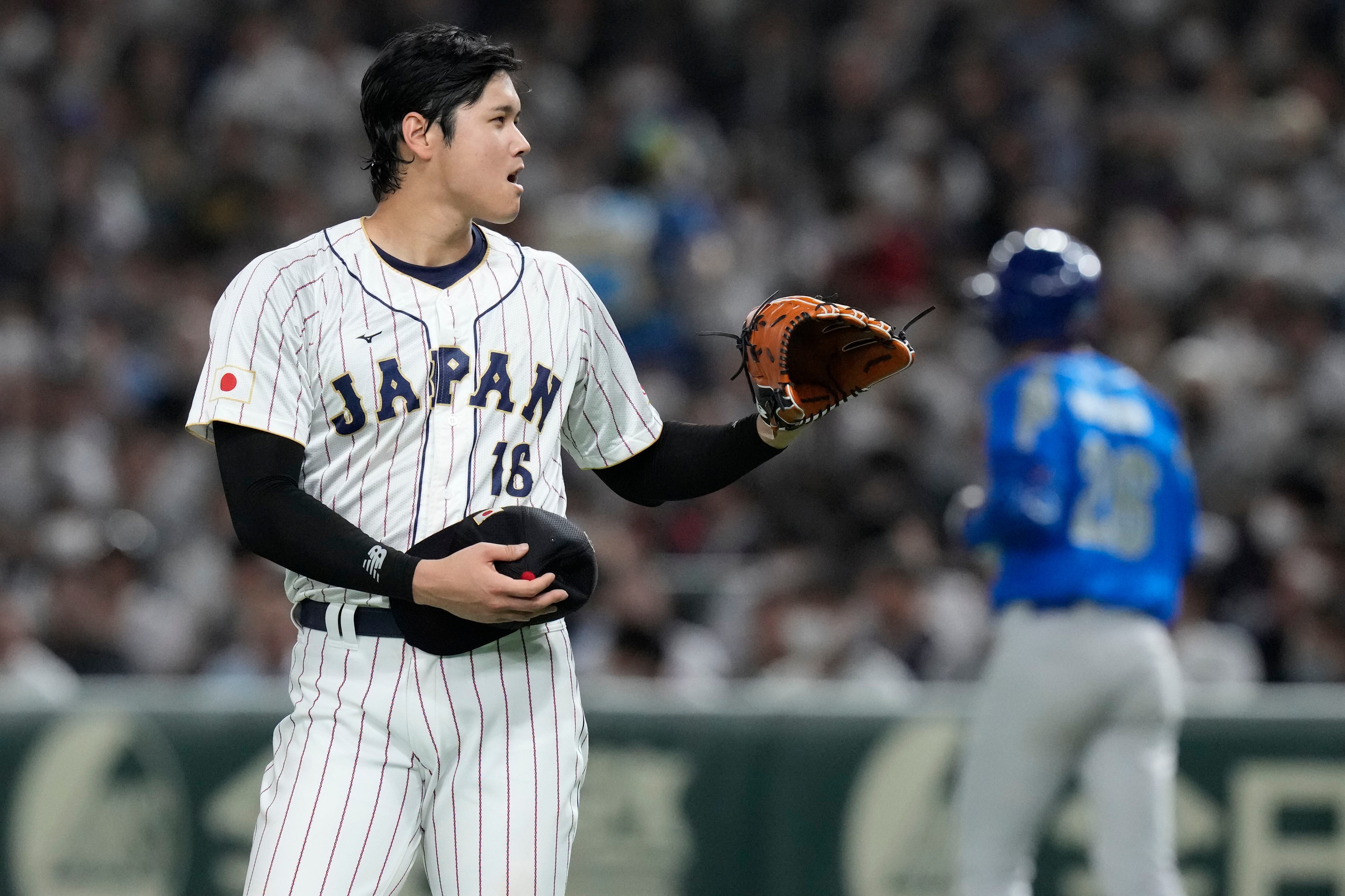 Shohei Ohtani of Japan reacts as Italy's shortstop Nicky Lopez