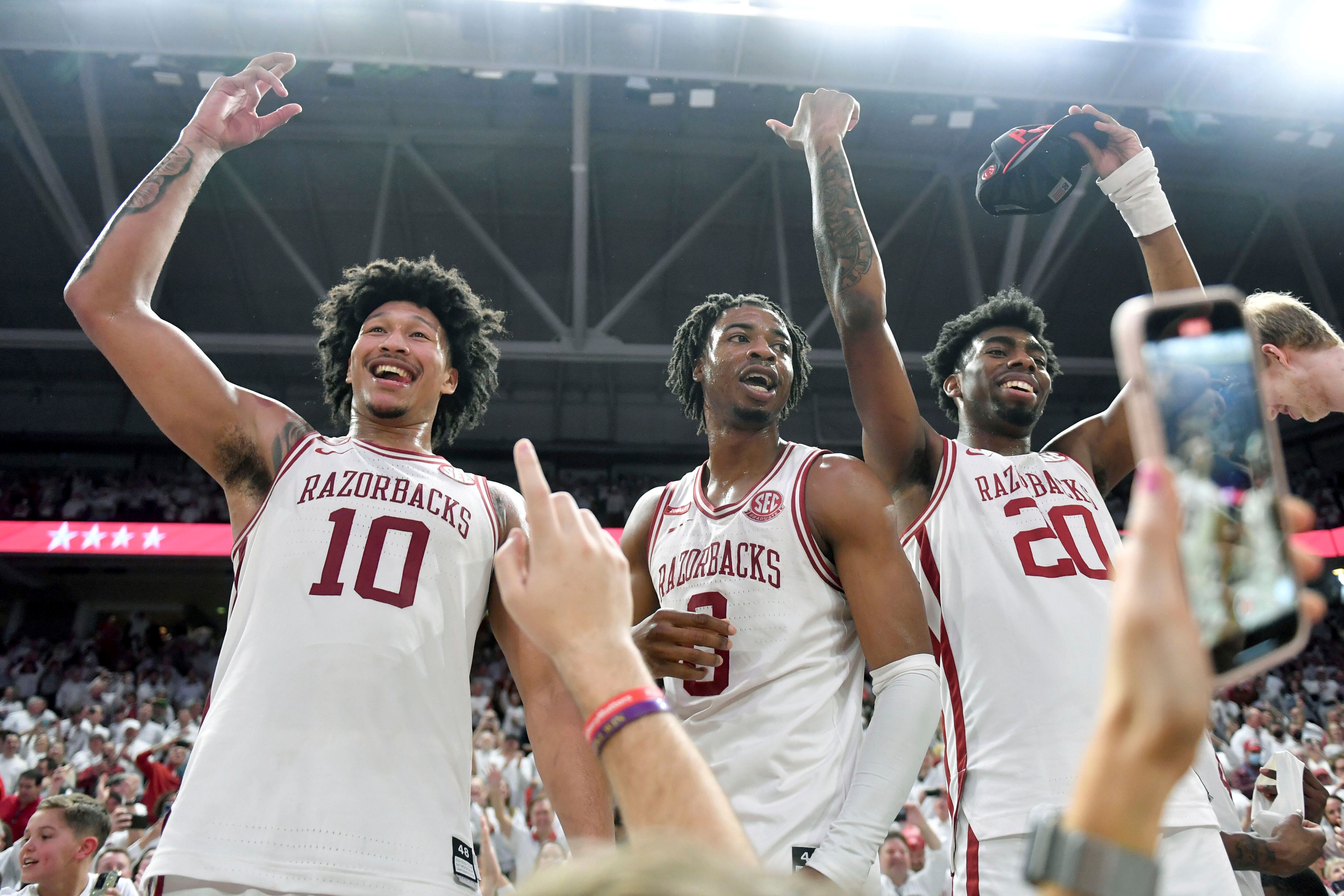 Hog wild! Unranked Arkansas upsets No. 1 Auburn 80-76 in OT